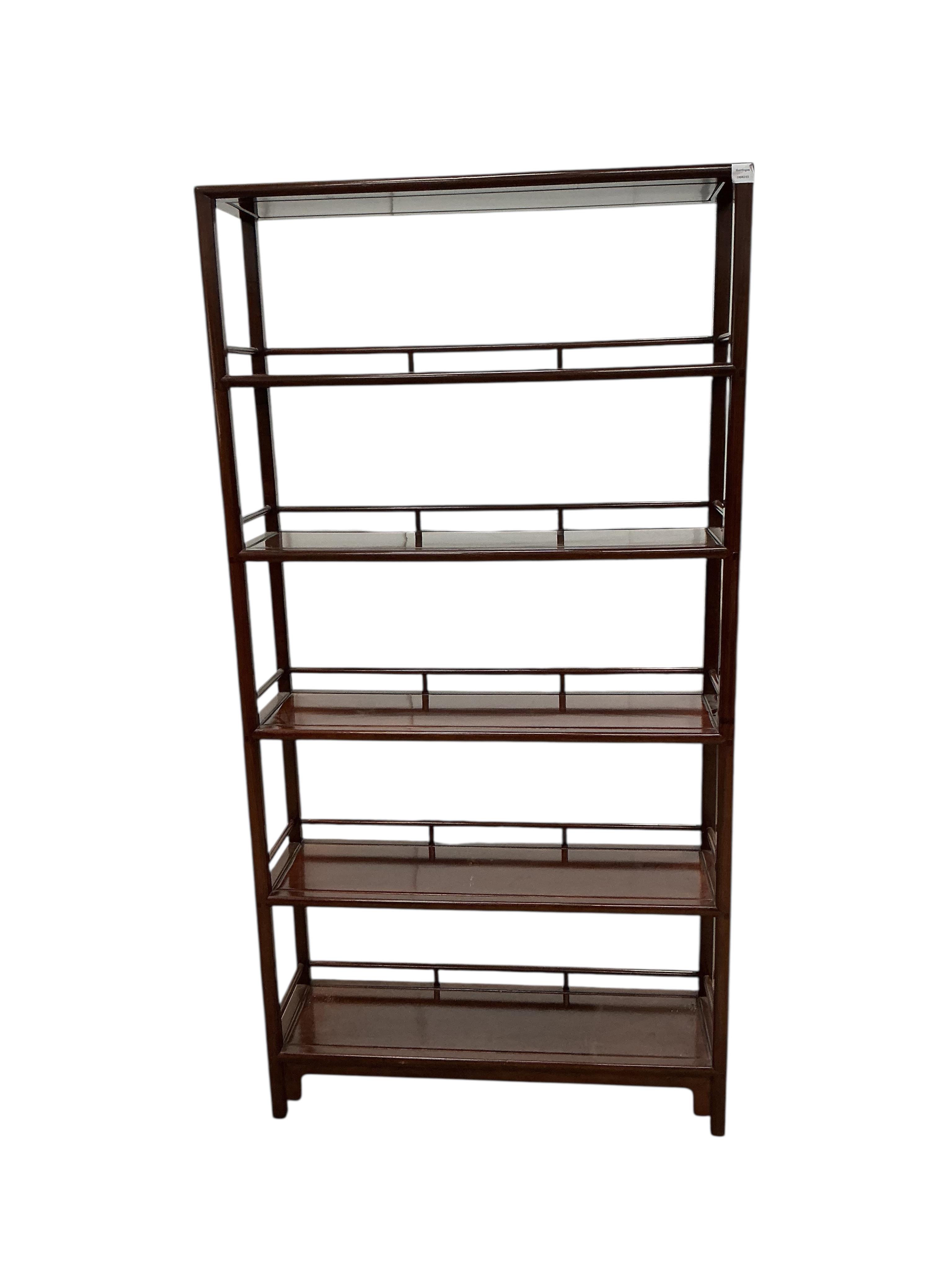 A Chinese hardwood open bookcase, width 100cm, depth 30cm, height 195cm
